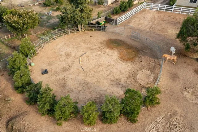 an aerial view of a house with outdoor space