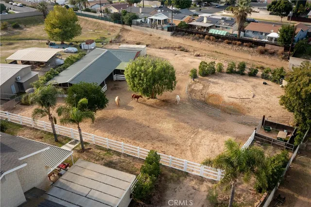 an aerial view of a house with outdoor space