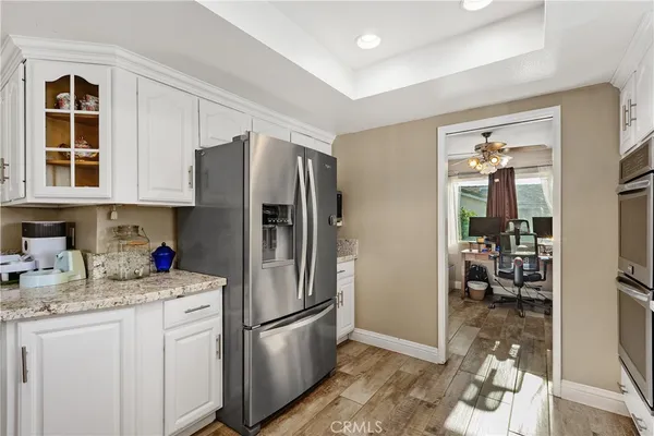 a kitchen with refrigerator a sink and cabinets