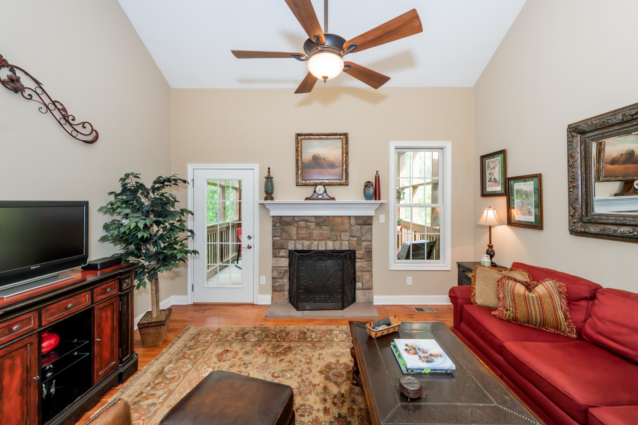 1833 Duncan Road, Unit 104 Knoxville, TN 37919 - Photo 11 of 36 a living room with furniture a flat screen tv and a fireplace