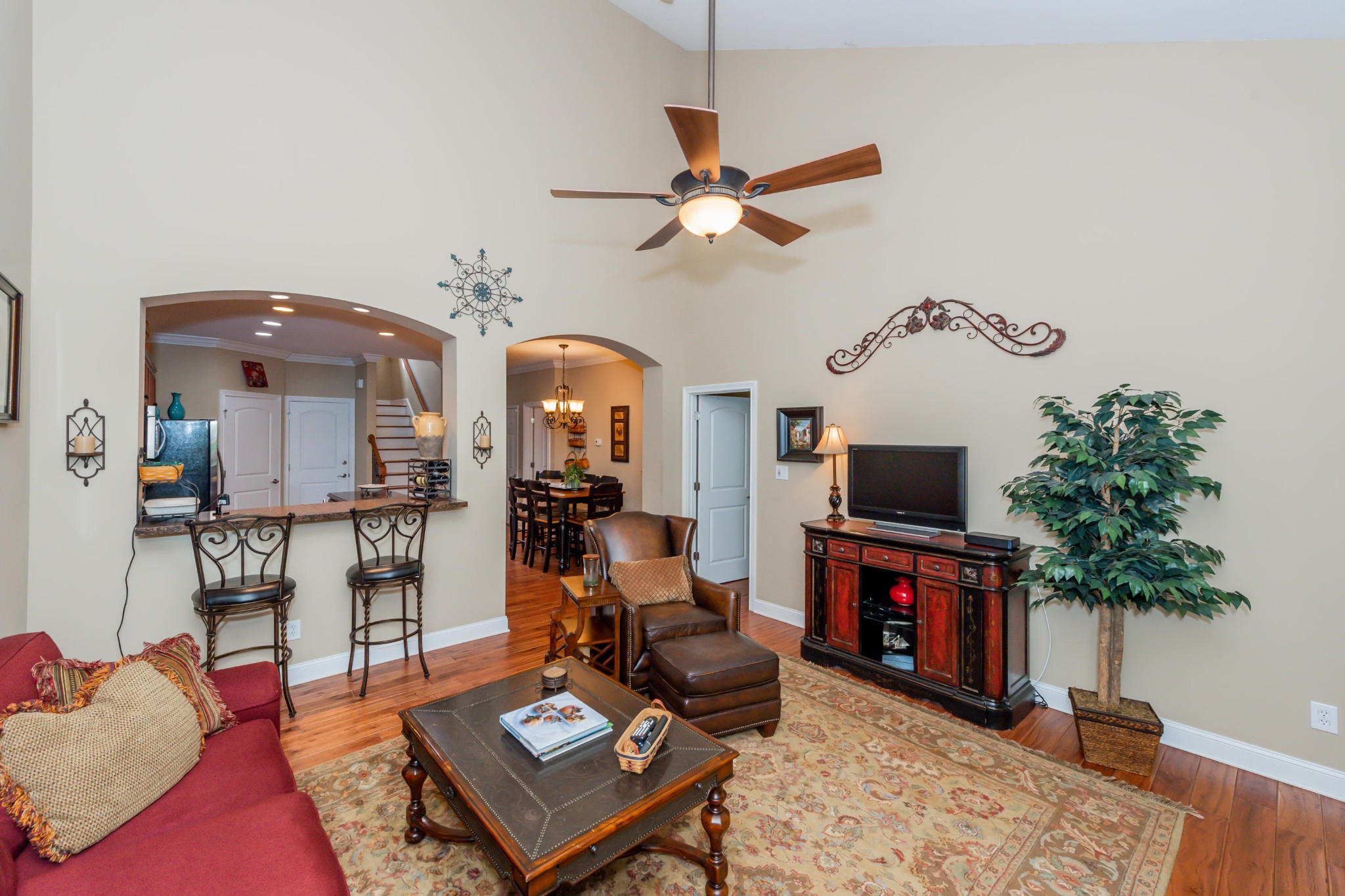 1833 Duncan Road, Unit 104 Knoxville, TN 37919 - Photo 15 of 36 a living room with furniture a fireplace and a flat screen tv