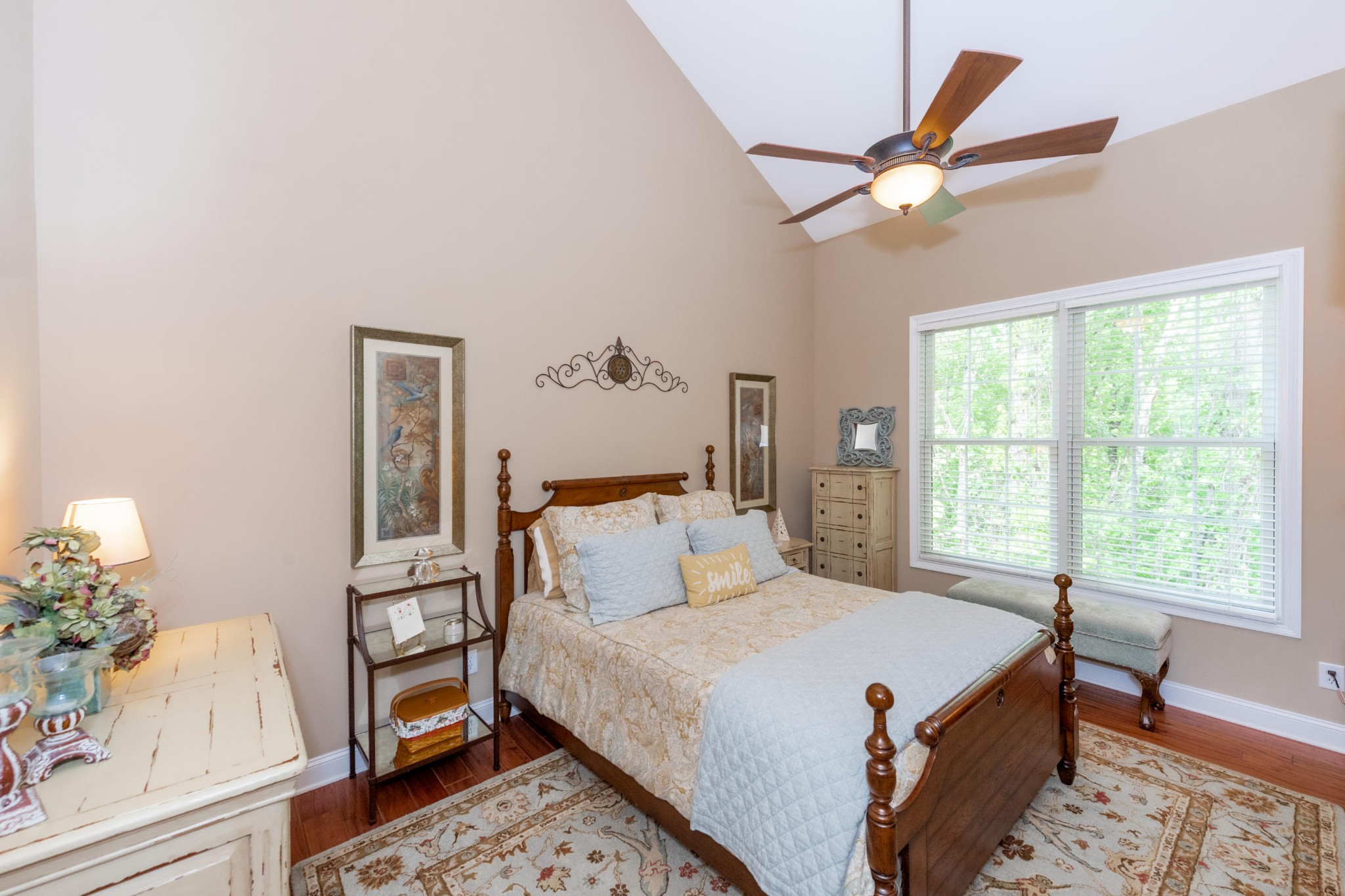 1833 Duncan Road, Unit 104 Knoxville, TN 37919 - Photo 16 of 36 a bedroom with a bed and a chandelier
