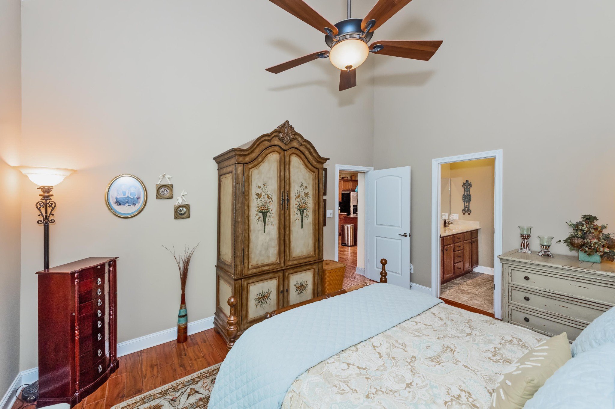 1833 Duncan Road, Unit 104 Knoxville, TN 37919 - Photo 17 of 36 a bedroom with a bed and a chandelier