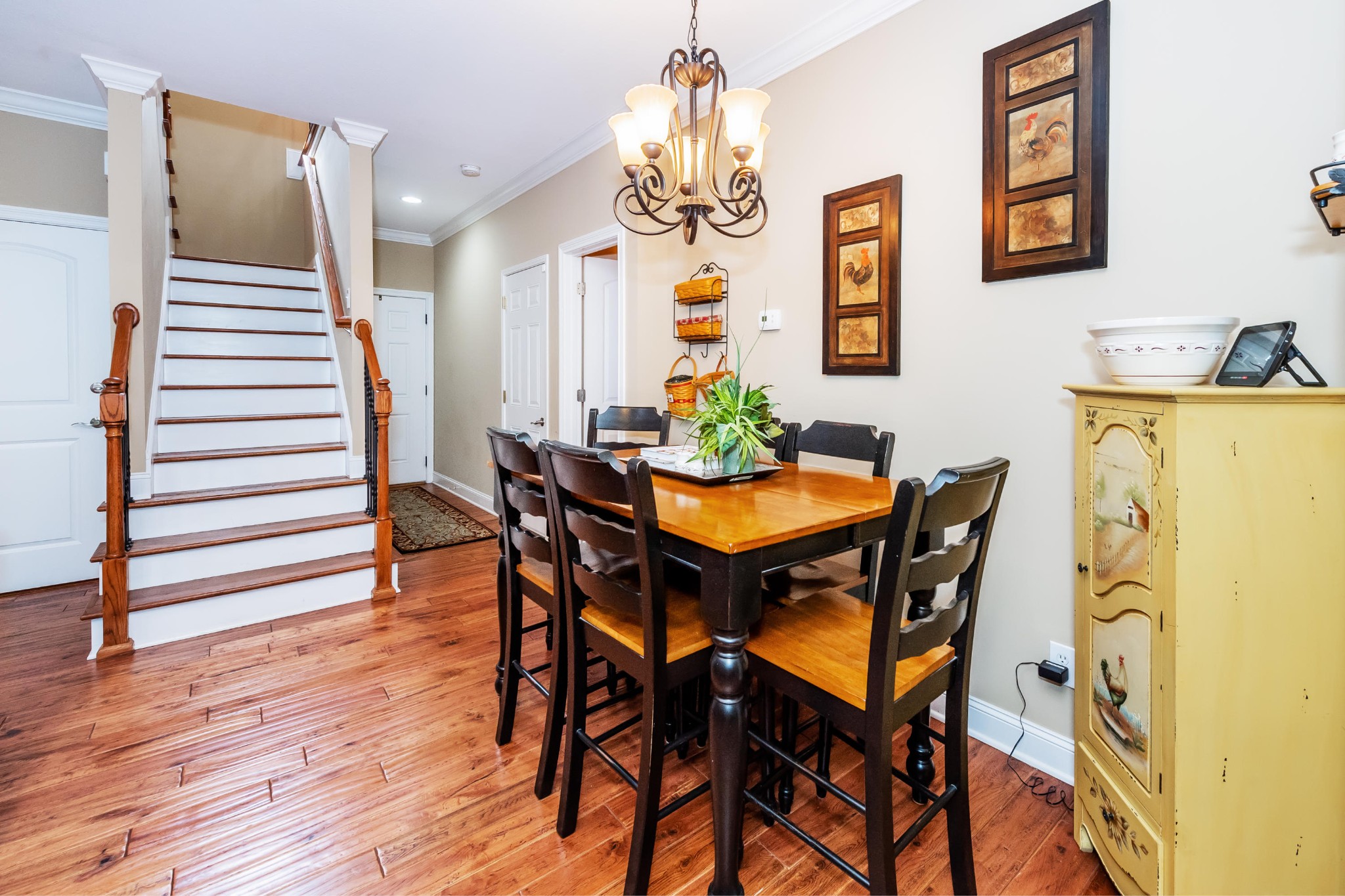 1833 Duncan Road, Unit 104 Knoxville, TN 37919 - Photo 21 of 36 a view of a dining room with furniture and wooden floor