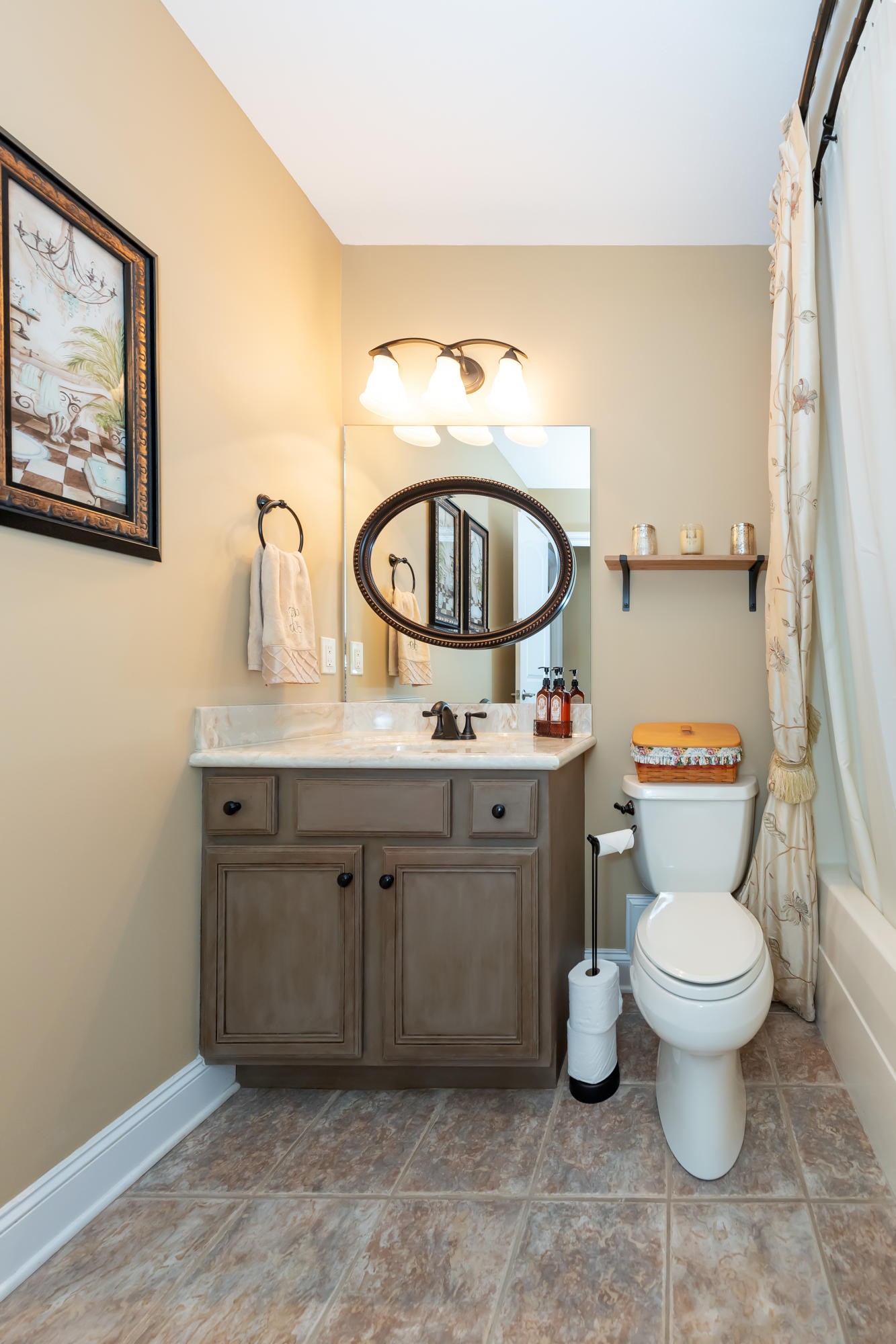 1833 Duncan Road, Unit 104 Knoxville, TN 37919 - Photo 28 of 36 a bathroom with a toilet sink and mirror