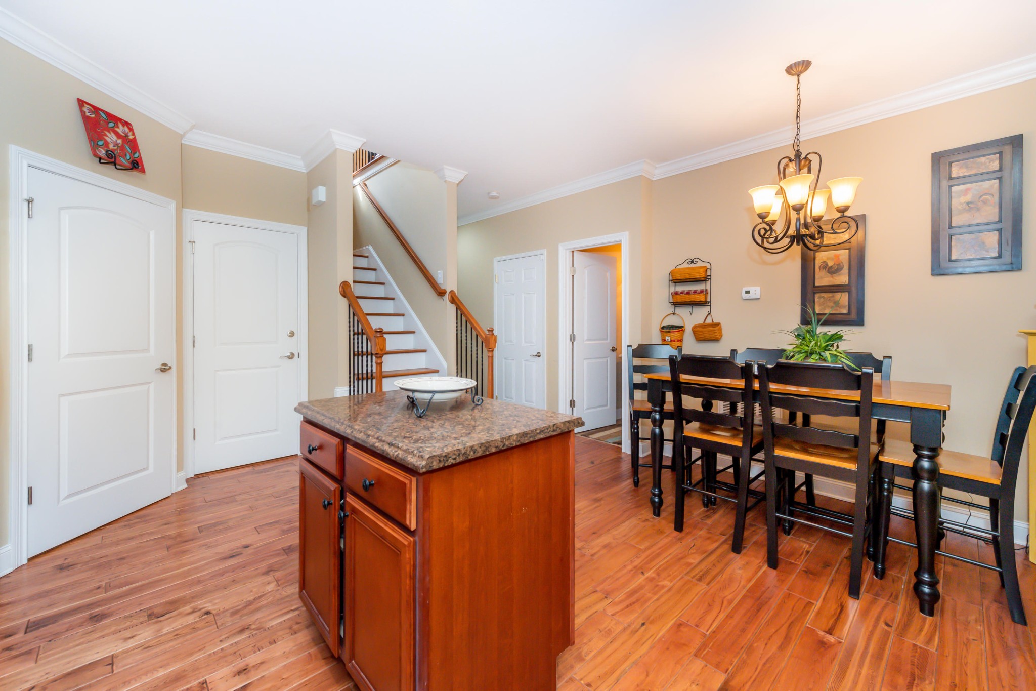 1833 Duncan Road, Unit 104 Knoxville, TN 37919 - Photo 8 of 36 a dining room with furniture and wooden floor