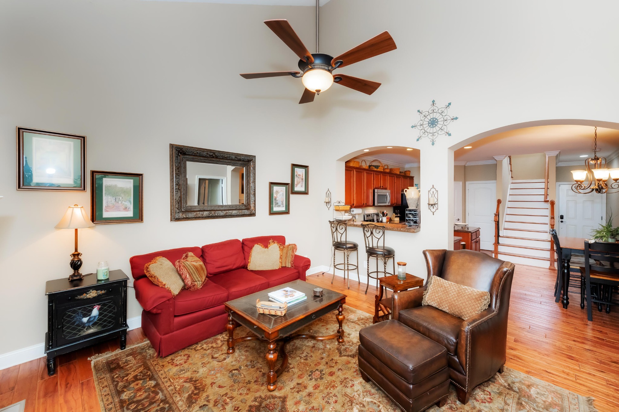 1833 Duncan Road, Unit 104 Knoxville, TN 37919 - Photo 10 of 36 a living room with furniture a ceiling fan and a rug