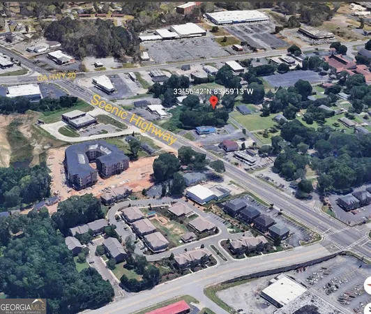 a view of a street with small houses