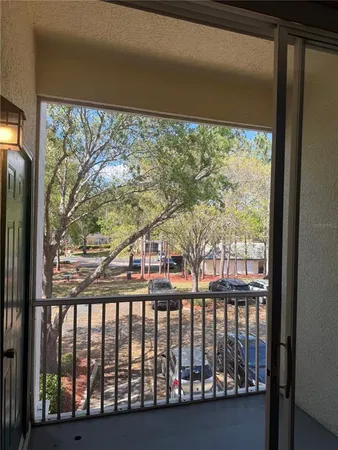 a view of trees from a balcony