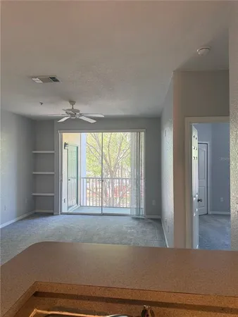 a living room with a couch and large window