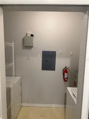 a bathroom with a shower and a sink