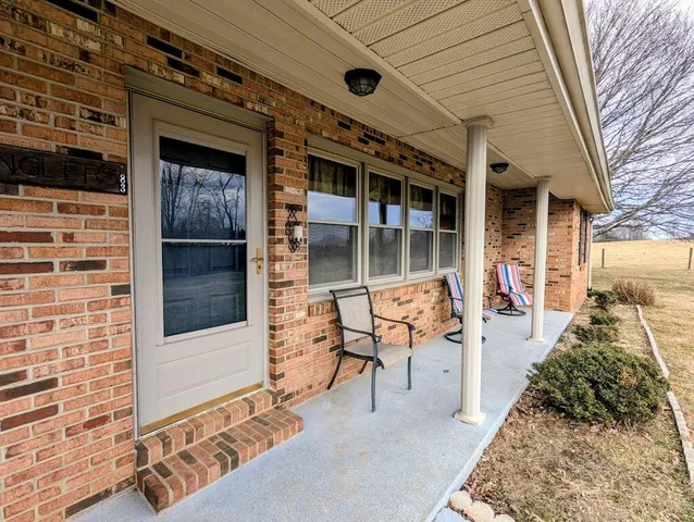 a view of a porch with seating space