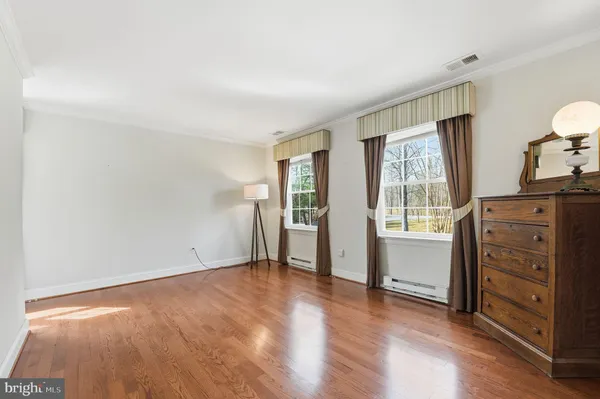 a bathroom with a shower and a window