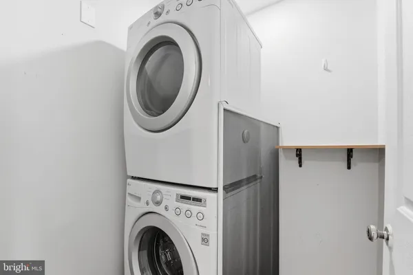 a kitchen with a refrigerator and a stove top oven