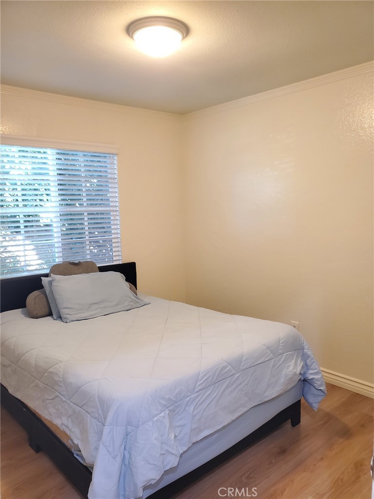 4459 Clarksdale Drive Riverside, CA 92505 - Photo 6 of 12 a bedroom with a bed and window