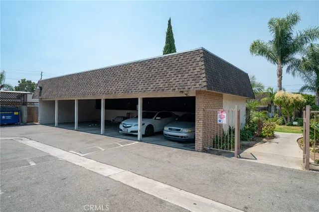 a view of a house with sitting area and garden