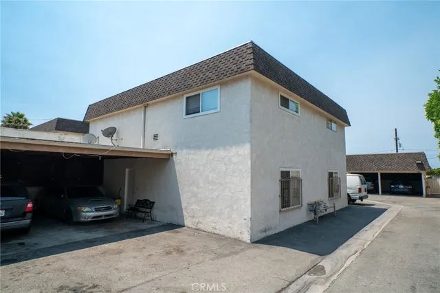 a view of a car park in front of house