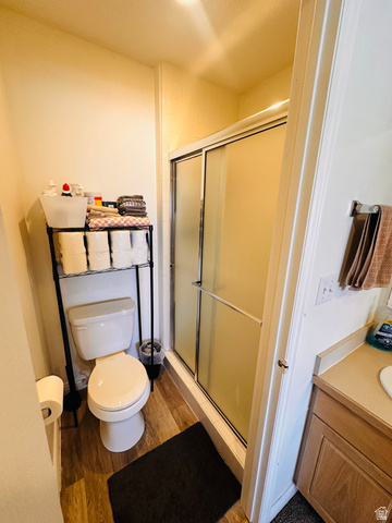 1559 Riverside Avenue, Unit 9 Provo, UT 84604 - Photo 6 of 12 Bathroom featuring light wood finished floors, vanity, and a stall shower