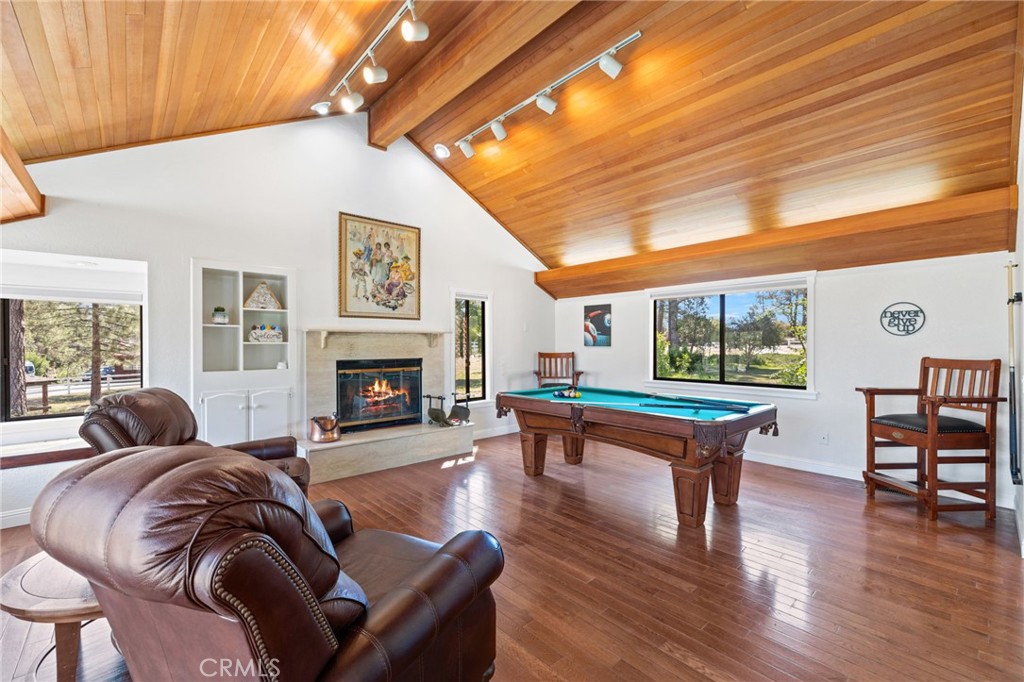 61116 Devils Ladder Road Mountain Center, CA 92561 - Photo 14 of 74 a living room with furniture and a fireplace