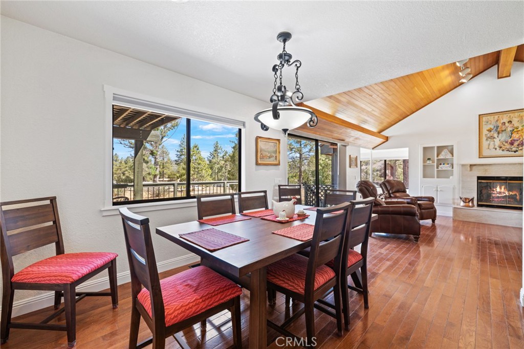 61116 Devils Ladder Road Mountain Center, CA 92561 - Photo 17 of 74 a view of a dining room with furniture window and wooden floor