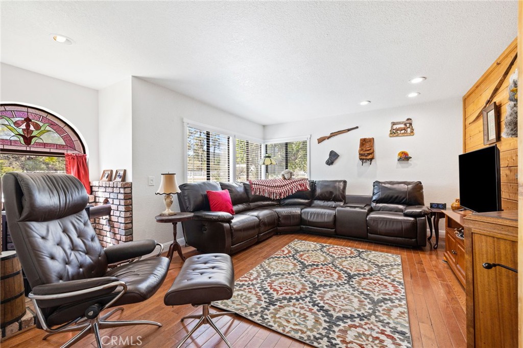 61116 Devils Ladder Road Mountain Center, CA 92561 - Photo 30 of 74 a living room with furniture and a flat screen tv