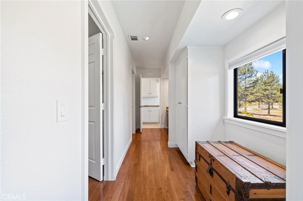 61116 Devils Ladder Road Mountain Center, CA 92561 - Photo 38 of 74 a view of a hallway with wooden floor and staircase