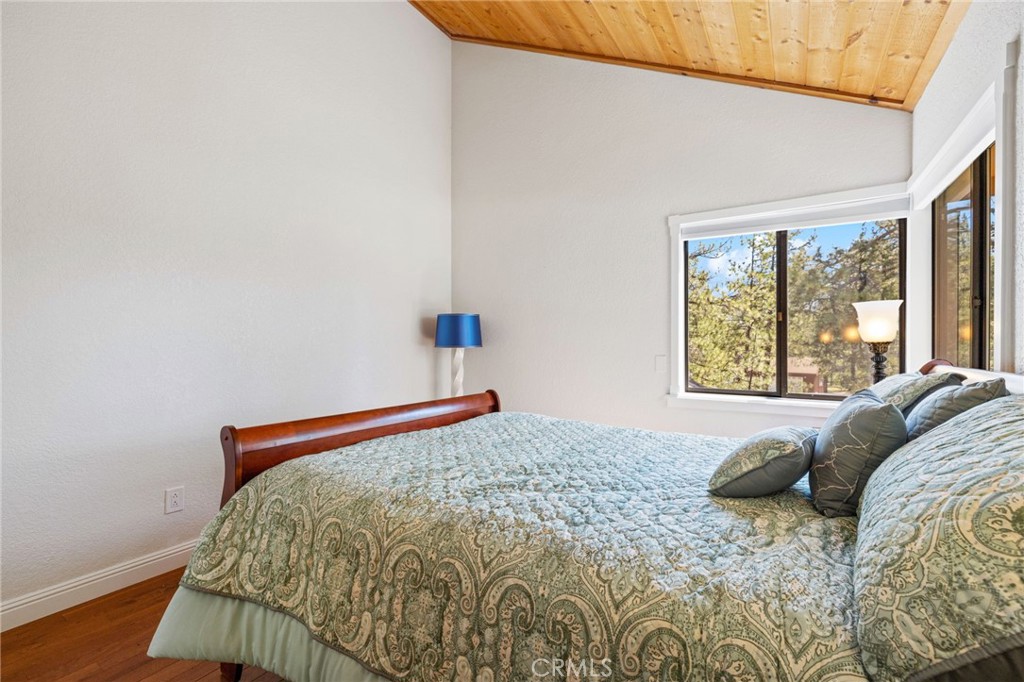 61116 Devils Ladder Road Mountain Center, CA 92561 - Photo 44 of 74 a bed sitting in a bedroom next to a window