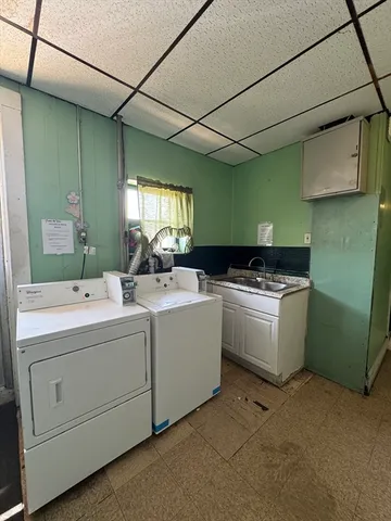 a room with a bed and cabinets