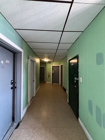 a room with a bed and a window