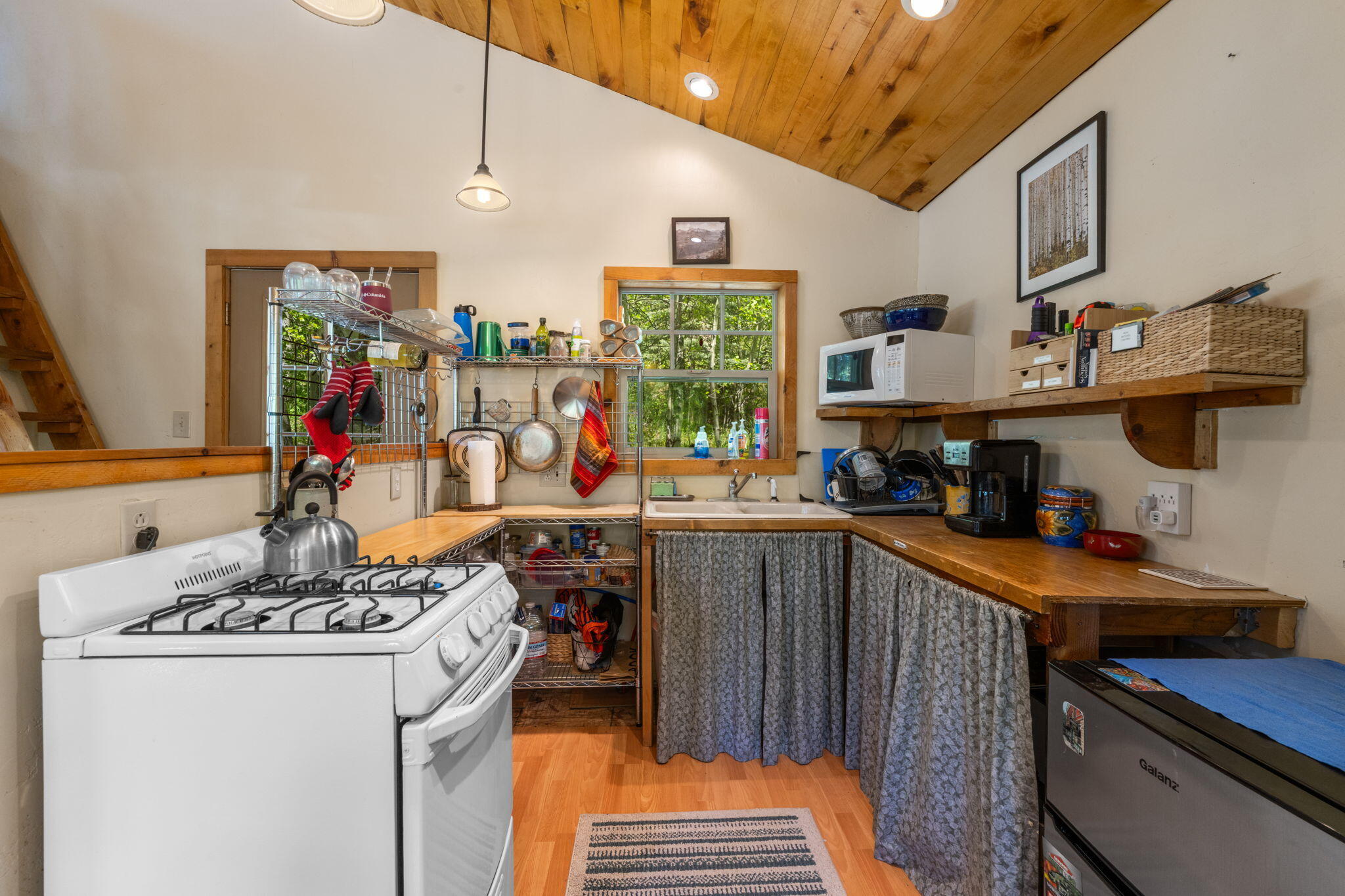 313 North Piedmont Street Rico, CO 81332 - Photo 25 of 43 a kitchen with a sink stove and cabinets