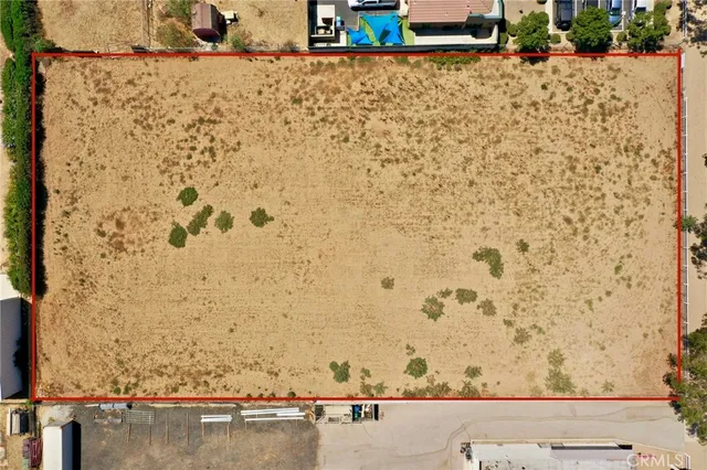 view of a wooden floor and a bench in the background