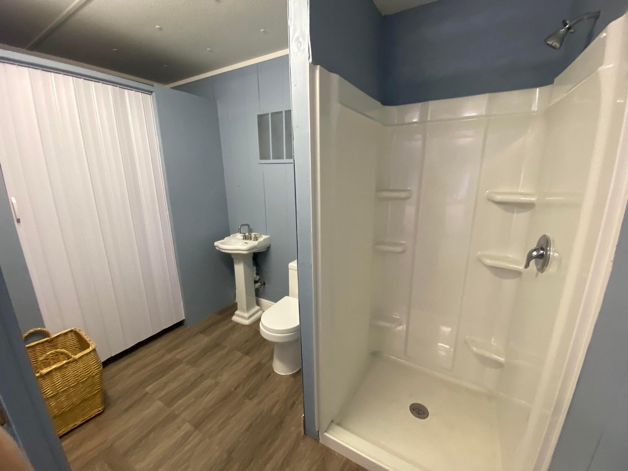 2141 B Road, Unit STUDIO Loxahatchee Groves, FL 33470 - Photo 5 of 6 a bathroom with a shower and toilet