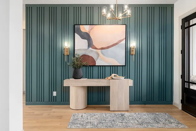 a view of a room with furniture and wooden floor