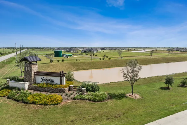 a view of a lake with a big yard
