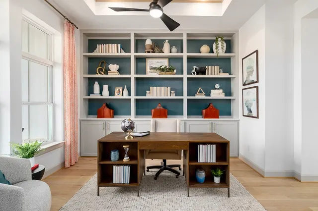 a view of a workspace with furniture