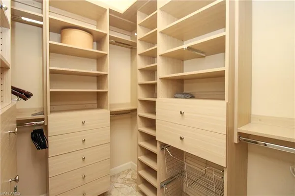 a view of an empty walk in closet