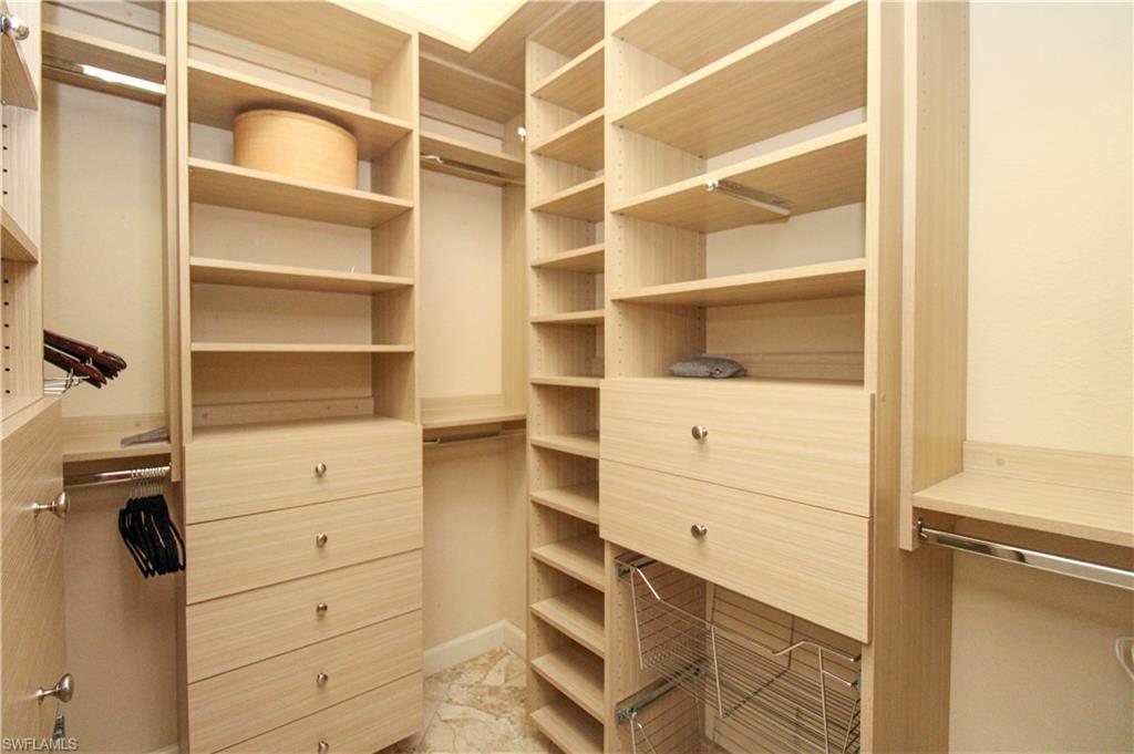627 Soliel Drive Naples, FL 34110 - Photo 20 of 45 a view of an empty walk in closet