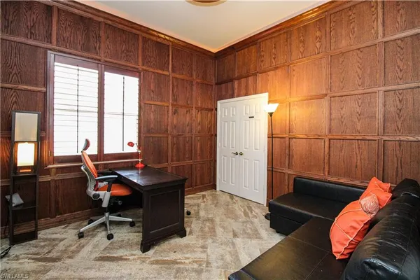 a workspace with furniture and window