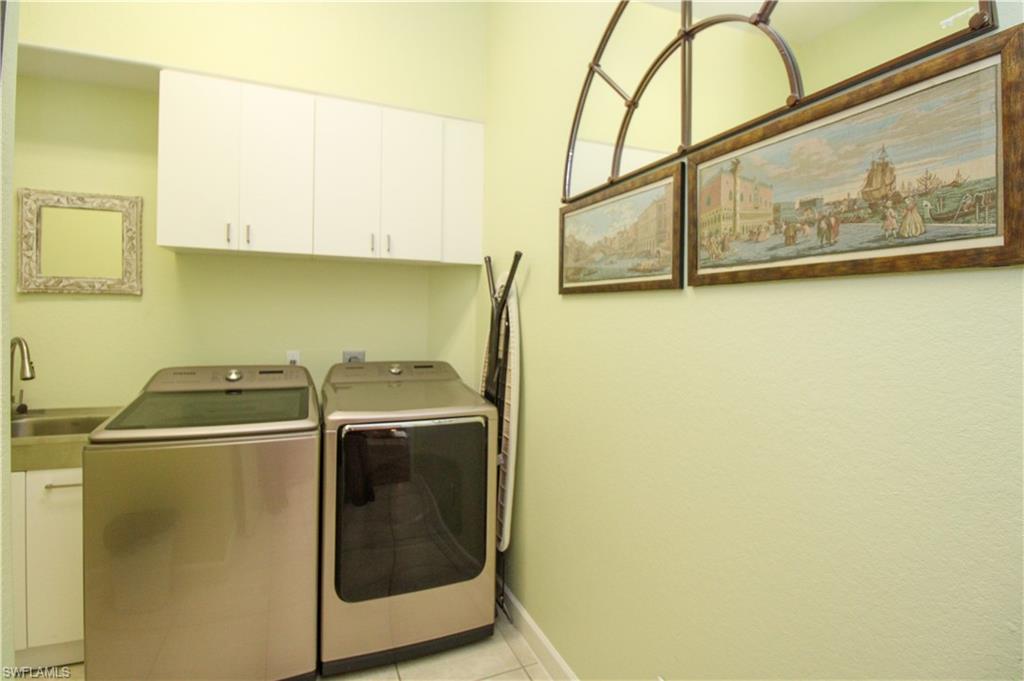 627 Soliel Drive Naples, FL 34110 - Photo 39 of 45 a close up of a washer and dryer