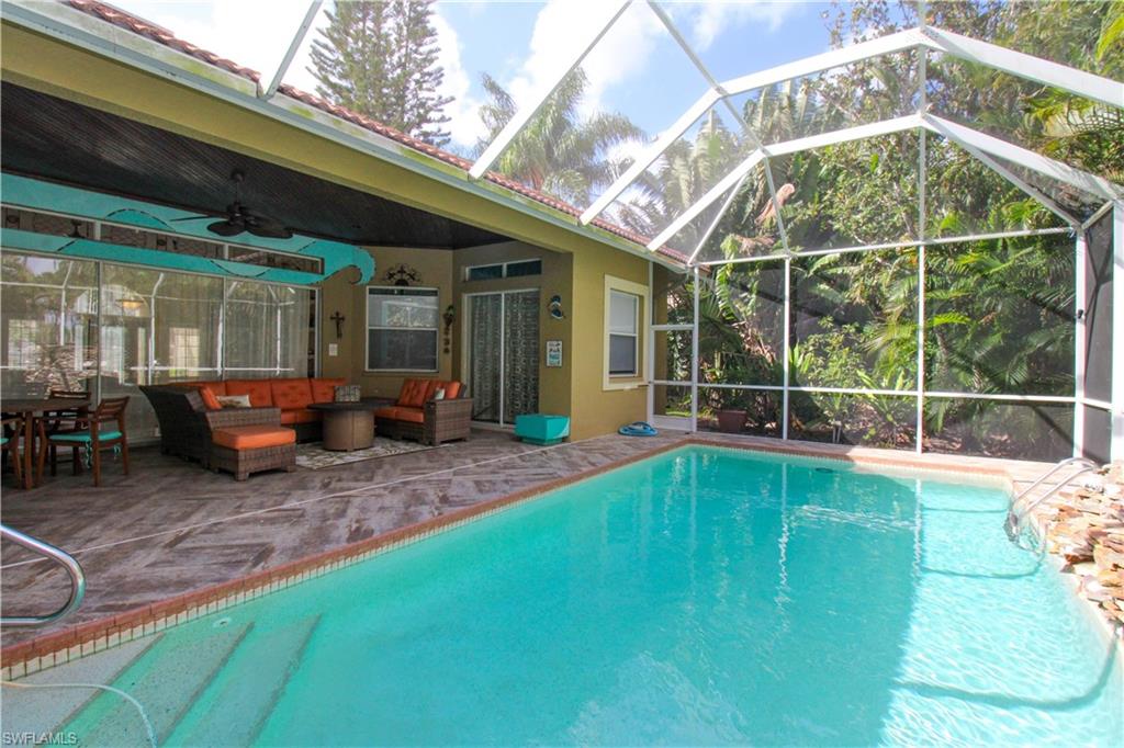 627 Soliel Drive Naples, FL 34110 - Photo 45 of 45 a view of a house with a backyard balcony and sitting area