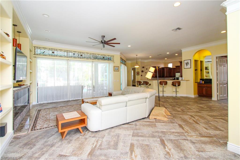 627 Soliel Drive Naples, FL 34110 - Photo 8 of 45 a living room with furniture and a large window