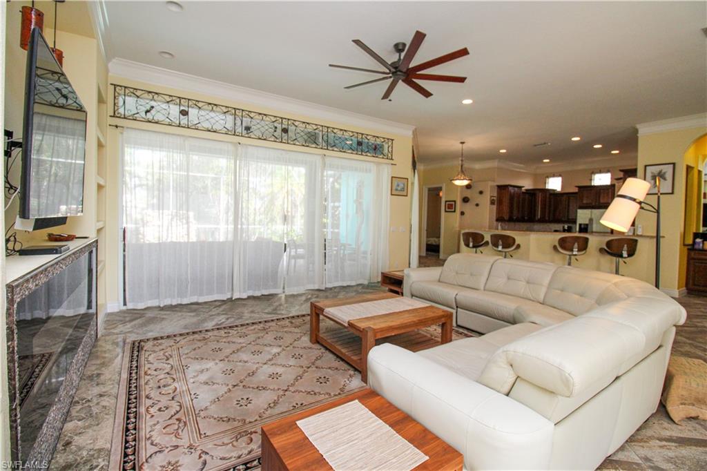 627 Soliel Drive Naples, FL 34110 - Photo 9 of 45 a living room with furniture and a large window