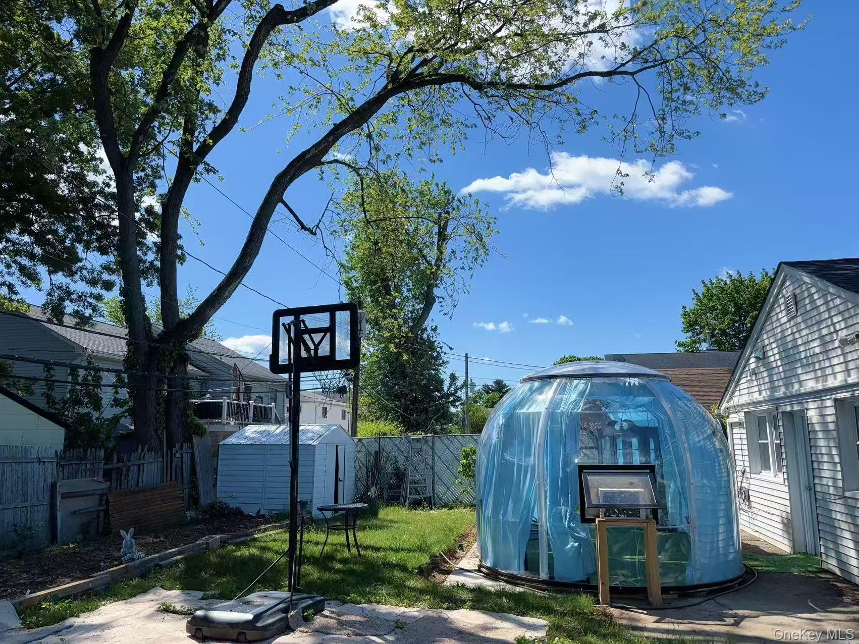 439 Newbridge Road East Meadow, NY 11554 - Photo 14 of 15 a front view of a house with a yard