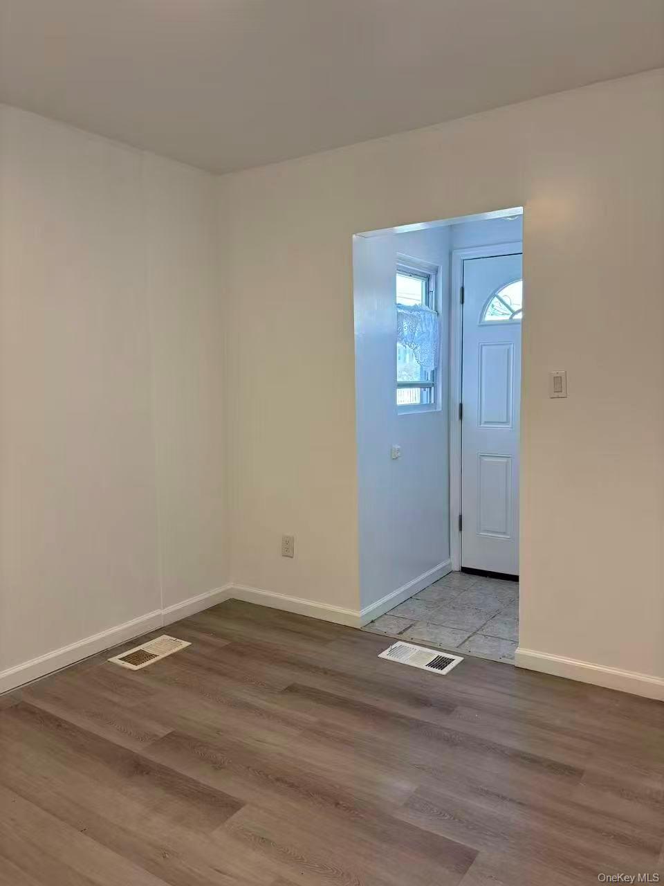 439 Newbridge Road East Meadow, NY 11554 - Photo 4 of 15 a view of a room with wooden floor