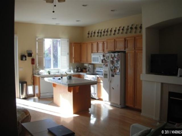 9911 Northrup Drive Reno, NV 89521 - Photo 6 of 13 a kitchen with stainless steel appliances granite countertop a sink stove and refrigerator