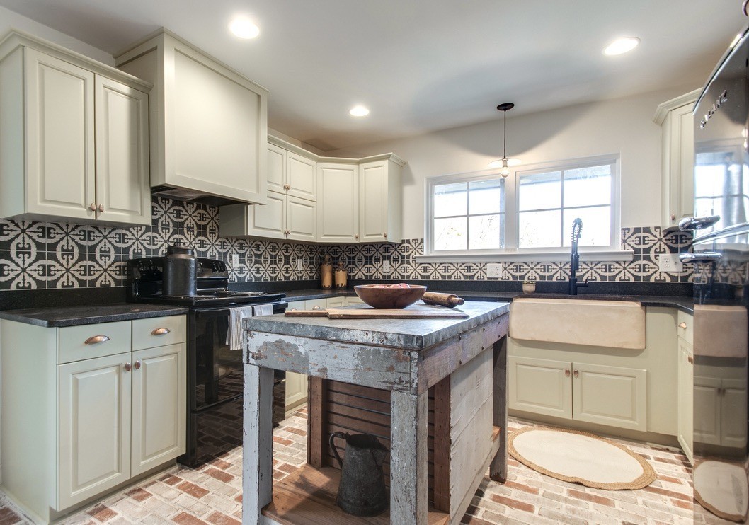 5570 Pinewood Road Franklin, TN 37064 - Photo 17 of 53 a kitchen with a sink stove and cabinets