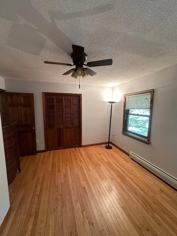 99 Old Poor Farm Road Ware, MA 01082 - Photo 13 of 29 a view of empty room with wooden floor and window
