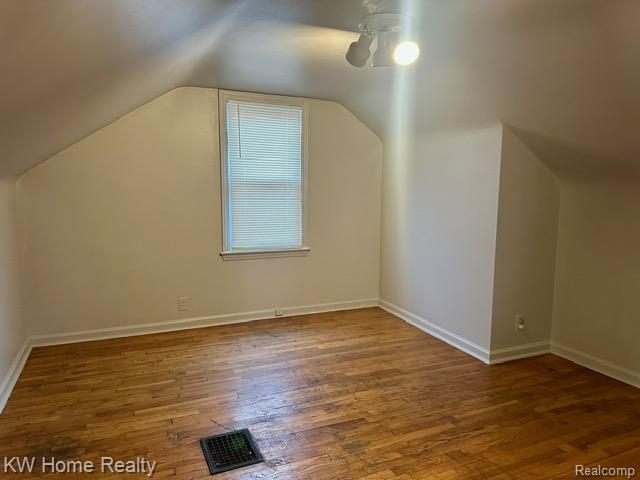 4607 Cadieux Road Detroit, MI 48224 - Photo 8 of 18 Bonus room with dark wood finished floors and baseboards
