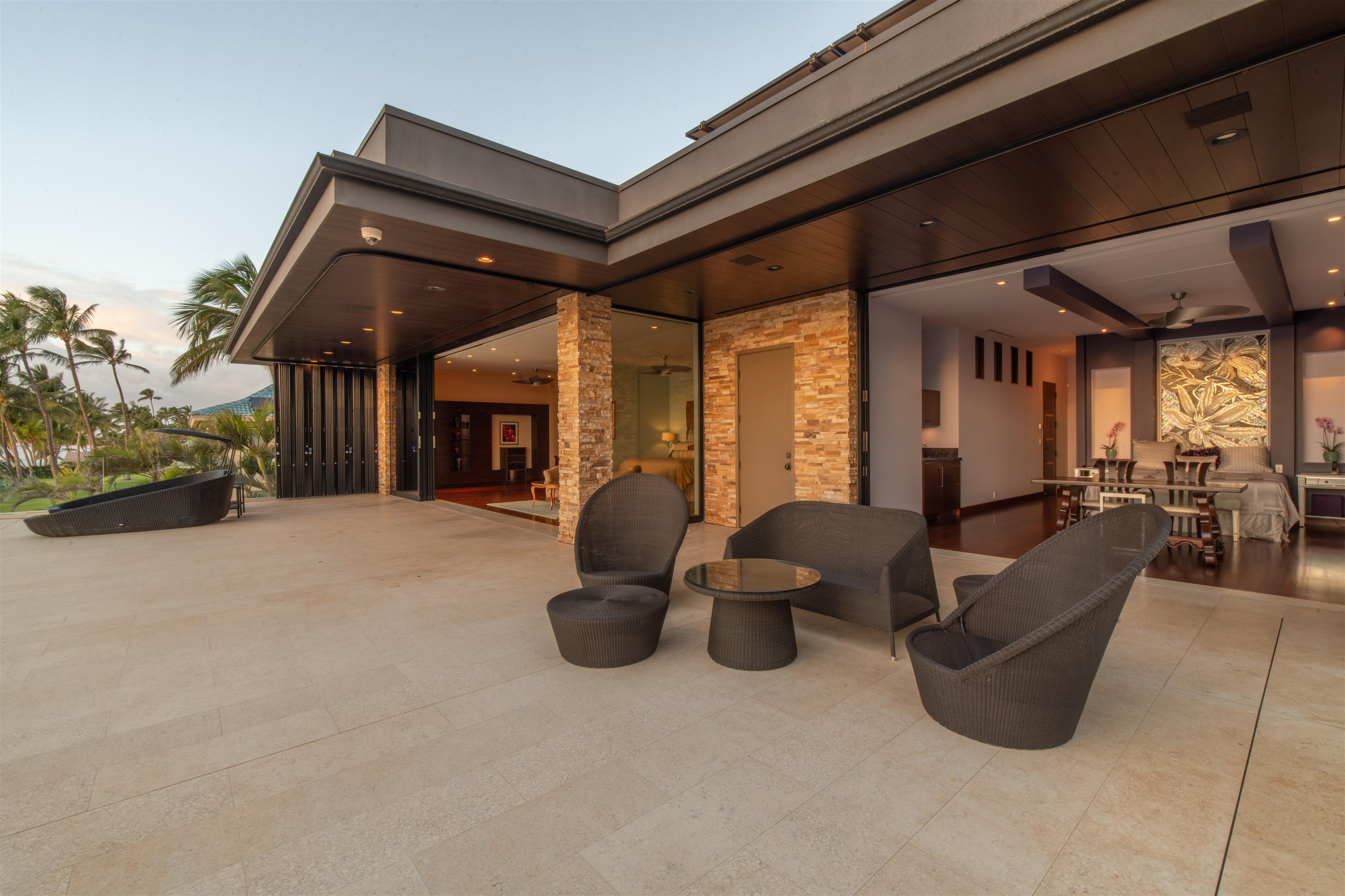 1750 Halama Street Kihei, HI 96753 - Photo 11 of 50 a building outdoor space with patio furniture and potted plants