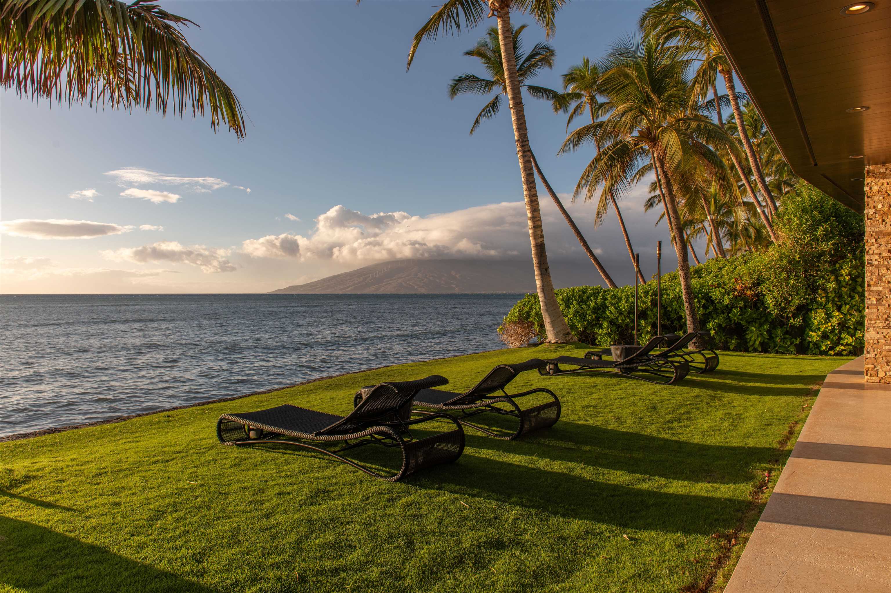 1750 Halama Street Kihei, HI 96753 - Photo 14 of 50 a view of a swimming pool with a yard and palm trees